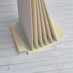 Переплет на 7 разворотов, с листами 15х15, цвет голубой, шаг 1 см